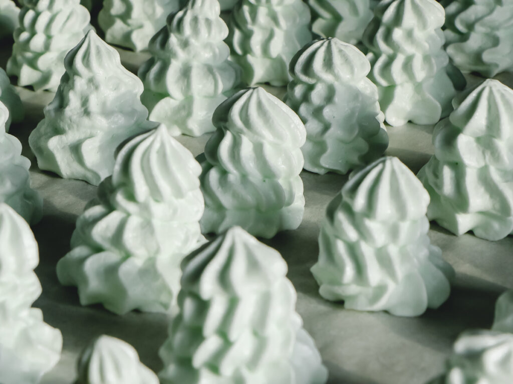 Mint Meringue cookies on a sheet pan.