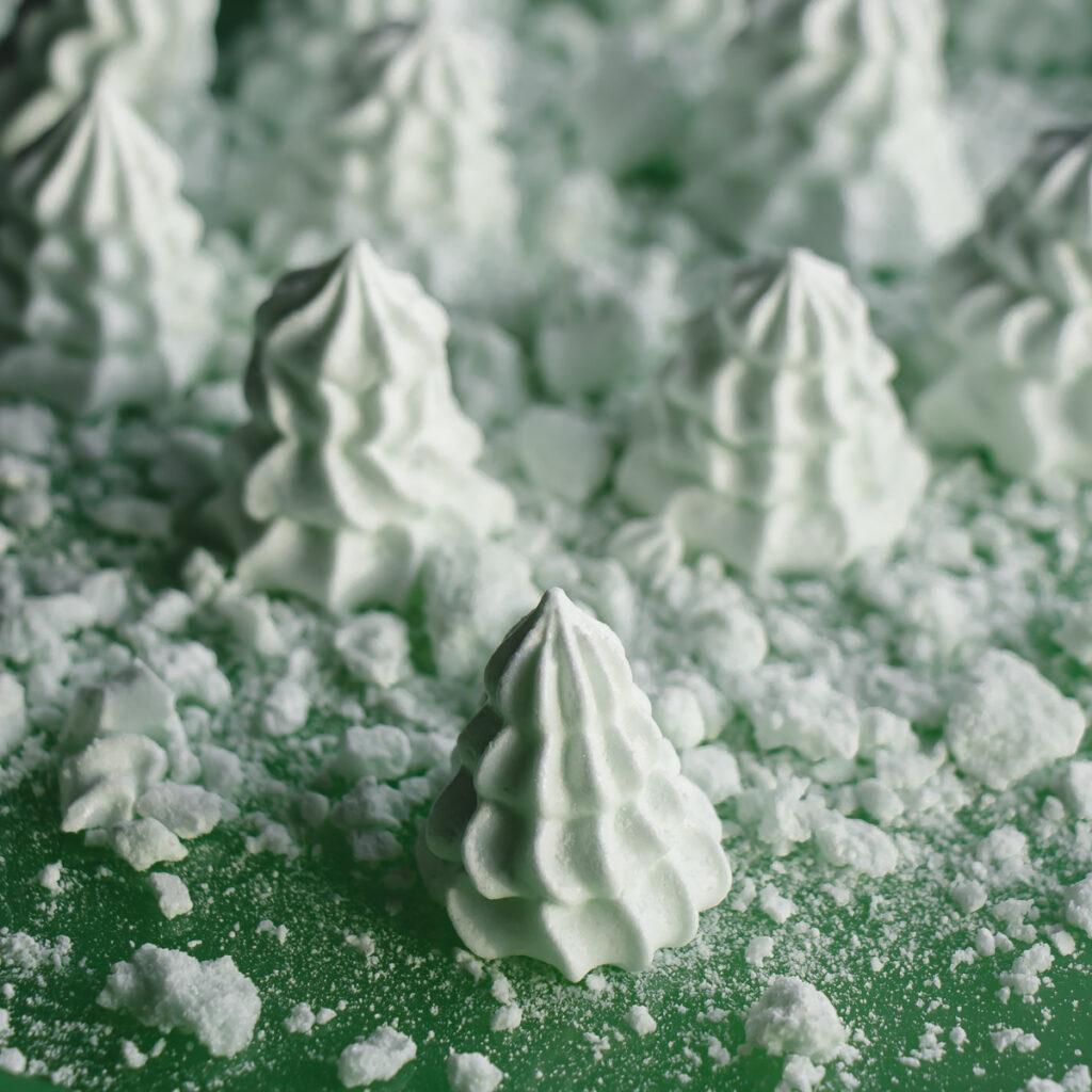 Tree-shaped mint meringue cookies.