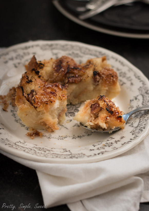 Pate of Bread pudding with brulee sugar top with bite-sized spoonful on the side.