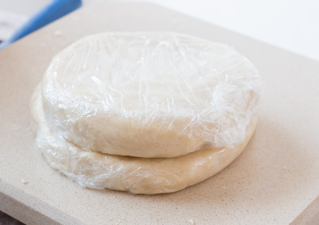 tightly wrapped discs of quiche dough.