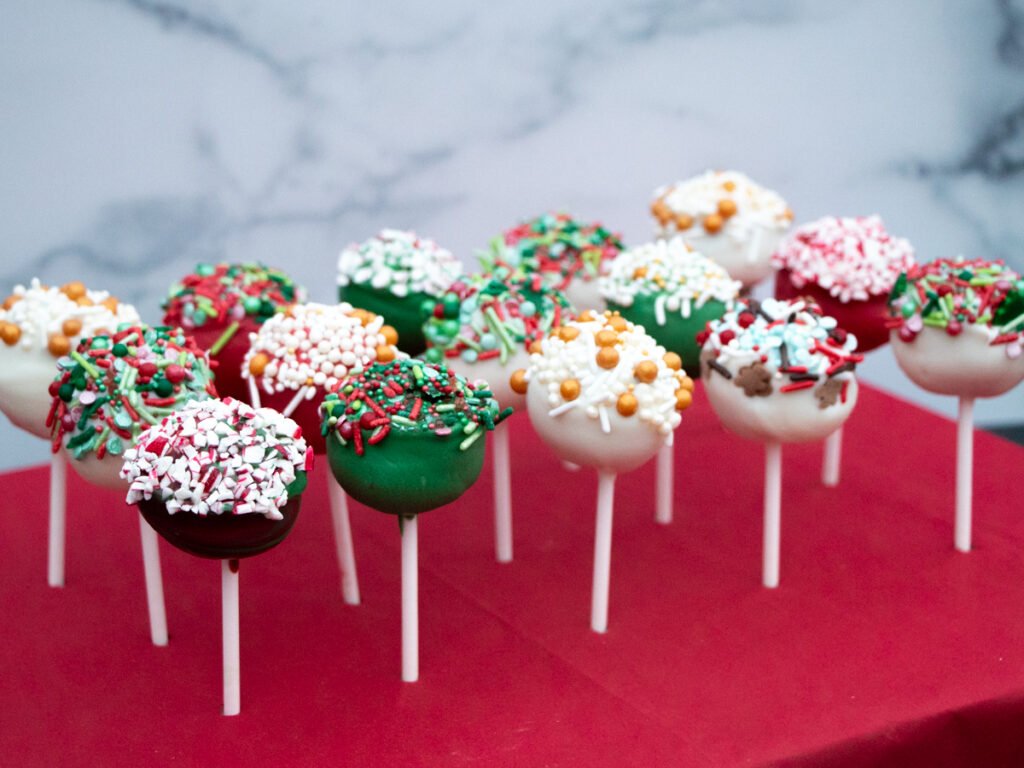 gingerbread cake pops with white chocolate and sprinkles