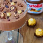 Easy chocolate mousse made of just nutella and whipped cream, garnished with ferrero rocher chocolates.