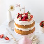 A simple strawberry cream cake made of layers of vanilla sponge cake, soft whipped cream, and fresh strawberries | rosechocolatier.com