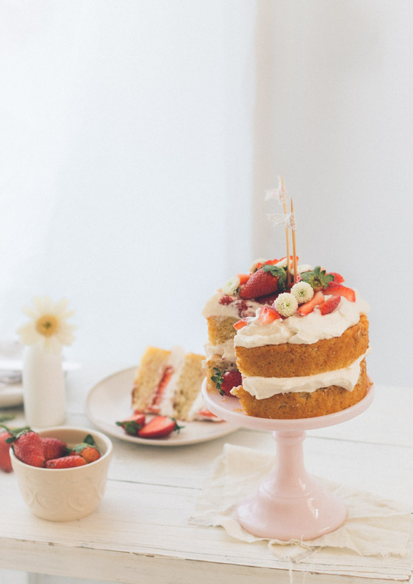 A simple strawberry cream cake made of layers of vanilla sponge cake, soft whipped cream, and fresh strawberries | rosechocolatier.com