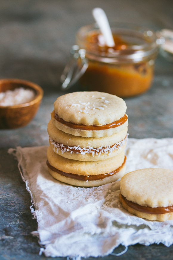 Classic alfajores filled with dulce de leche and rolled in shredded coconut | rosechocolatier.com