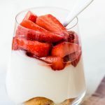 Strawberry white chocolate cheesecake in a jar. Delicious creamy white chocolate cream cheese mousse with fresh strawberries.