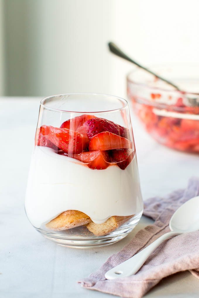 Strawberry white chocolate cheesecake in a glass.