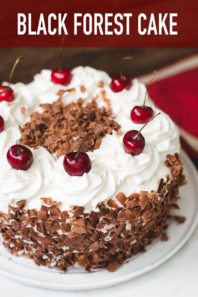 Super moist and flavorful black forest cake made with 4 layers of chocolate cake, cherries, and whipped cream.