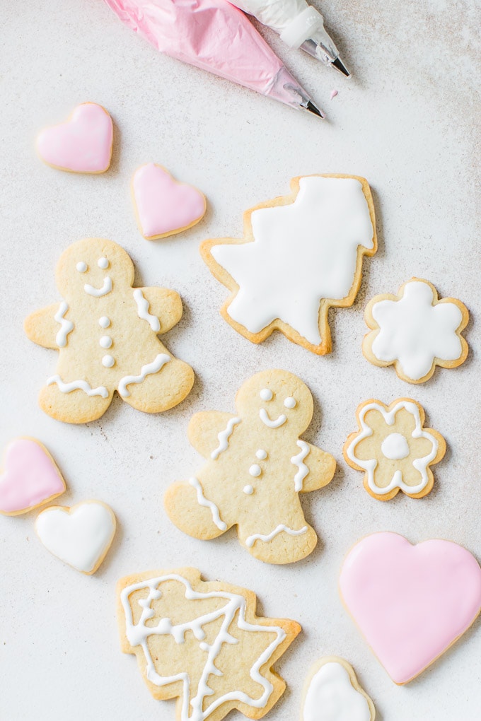 Sugary Royal Icing decorated on cut-out sugar cookies for the holidays.