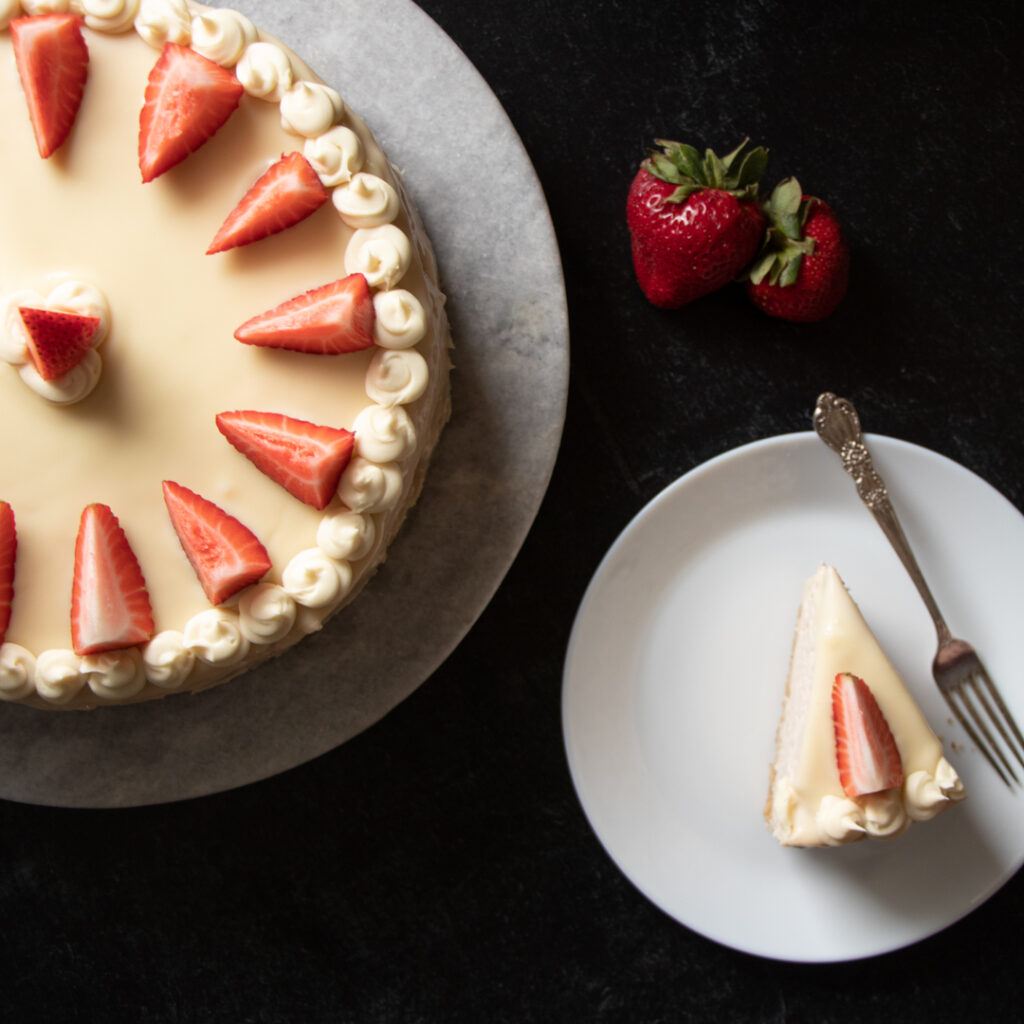 fresh strawberries with strawberry cheesecake with white chocolate ganache