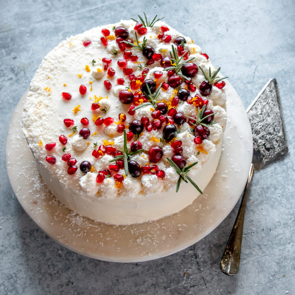 Orange layer cake with cranberry filling and cream cheese frosting