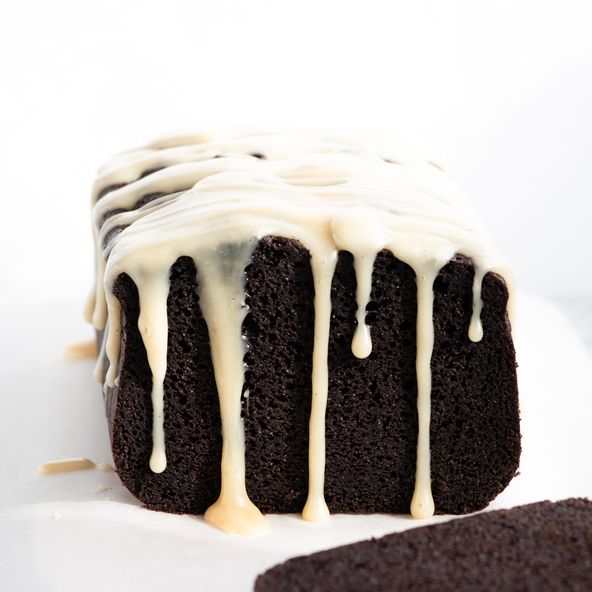 chocolate pound cake with vanilla sauce drizzle