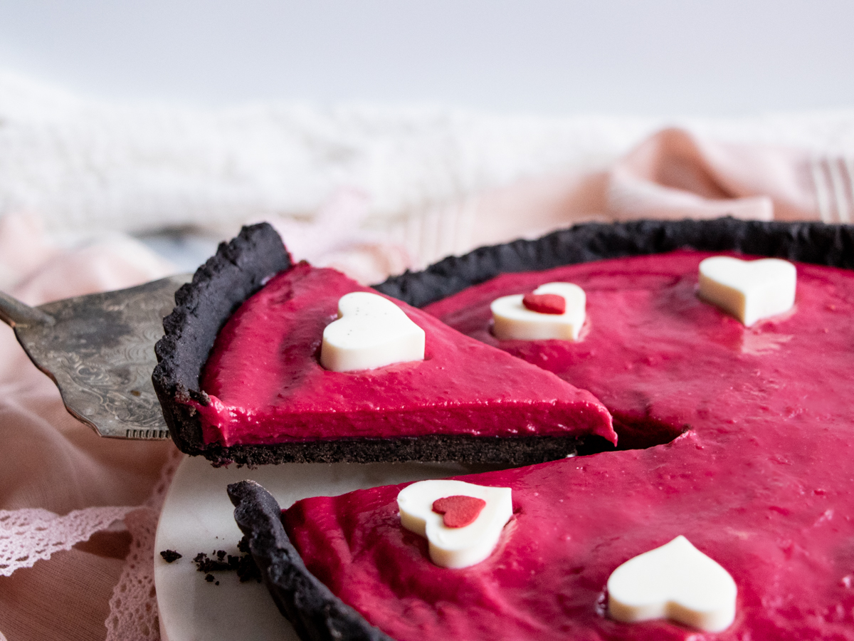 slice of raspberry black cocoa tart pie