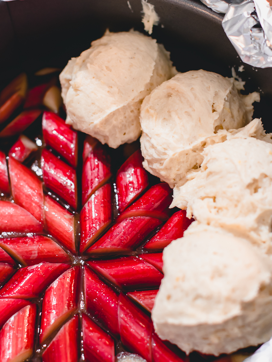 Use an ice cream scoop to place dough batter on top of the rhubarb in order to not mess up your design.