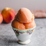 Homemade frozen peach sorbet made with real peaches.