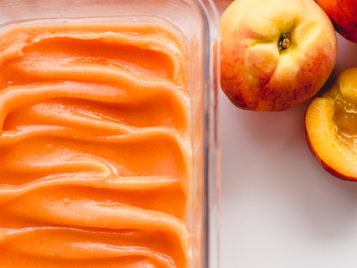 Frozen peach sorbet made with frozen peaches.