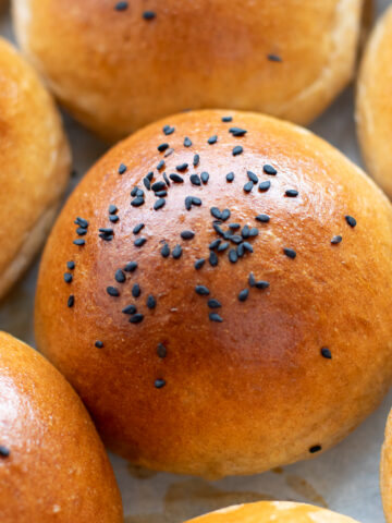 Whole wheat buns with black sesame seeds.